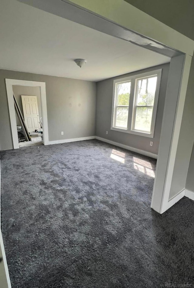 4716 Garland St, Detroit, MI 48214 - carpeted empty room with baseboards
