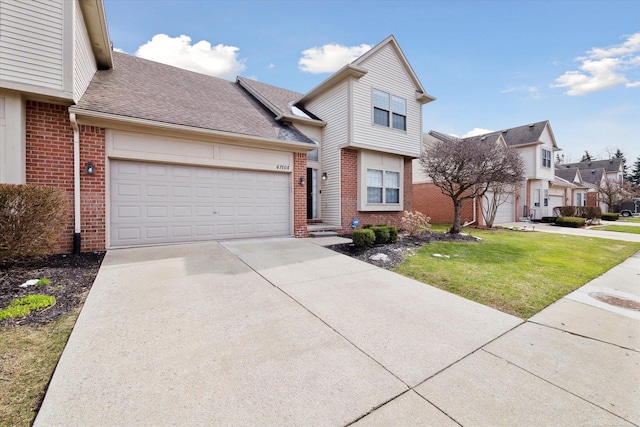 view of front facade featuring concrete driveway, an attached garage, brick siding, a front lawn, and a shingled roof