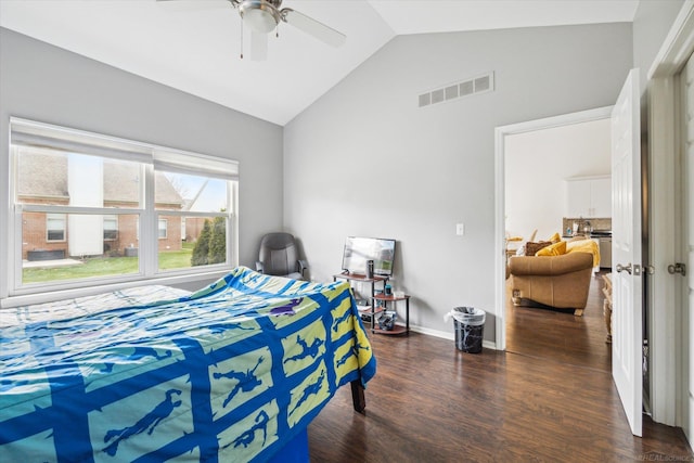 bedroom with vaulted ceiling, baseboards, visible vents, a ceiling fan, and wood finished floors