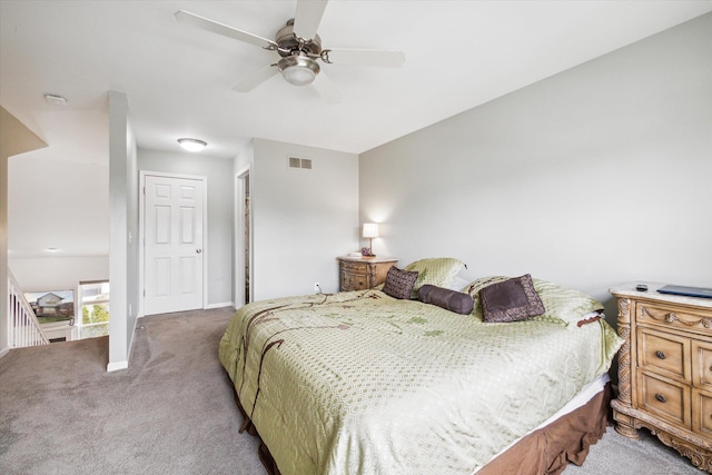 bedroom featuring light carpet, baseboards, visible vents, and a ceiling fan