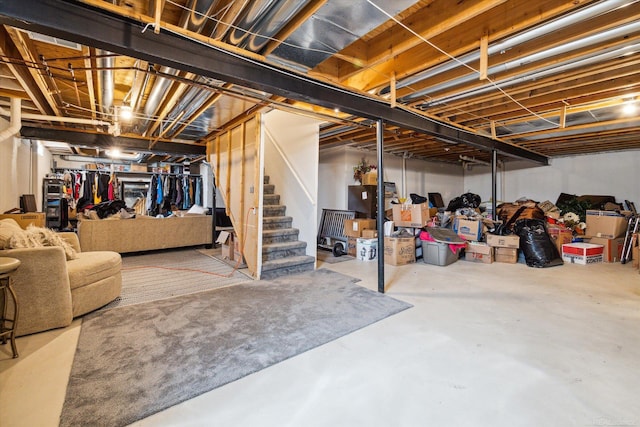 unfinished below grade area featuring stairway