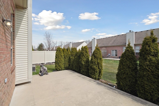 view of patio featuring fence