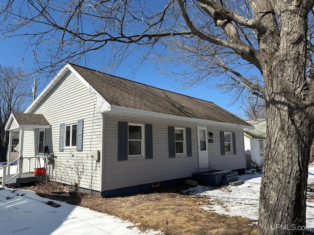 view of front of property with a shingled roof