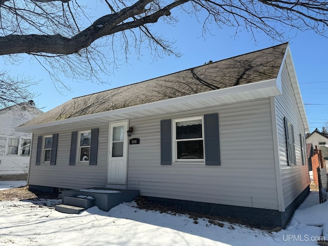 view of front of home with a shingled roof