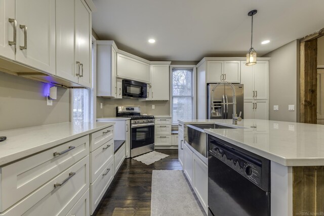 kitchen featuring light countertops, black appliances, white cabinets, and dark wood finished floors
