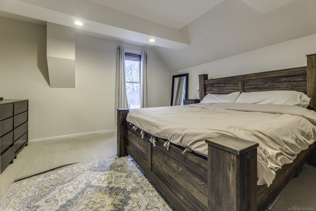 bedroom featuring light colored carpet, vaulted ceiling, recessed lighting, and baseboards