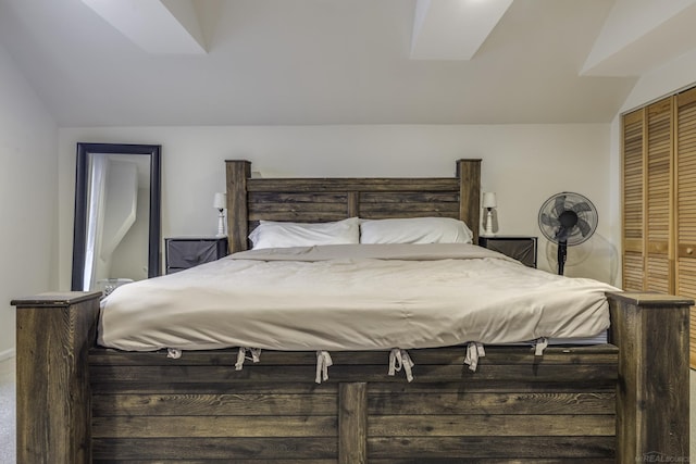 bedroom featuring a closet and vaulted ceiling
