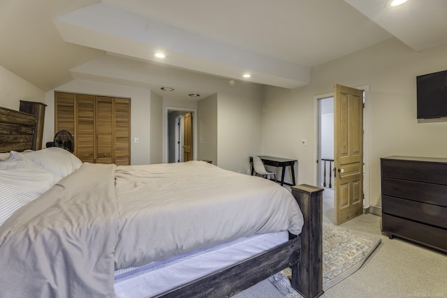 bedroom featuring vaulted ceiling, a closet, light colored carpet, and recessed lighting