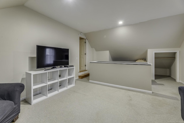 additional living space with light colored carpet, lofted ceiling, baseboards, and recessed lighting