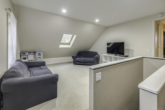 living room with recessed lighting, vaulted ceiling with skylight, and carpet flooring
