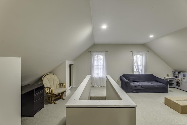 bonus room with lofted ceiling, recessed lighting, and light carpet