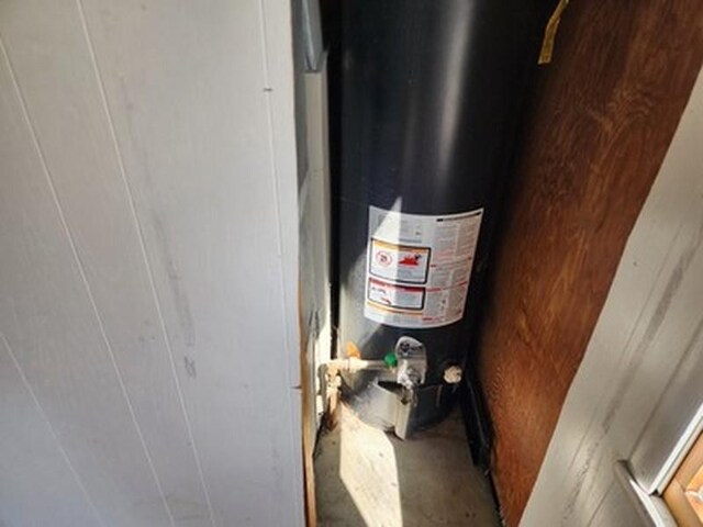 2488 Montana Ave, Saginaw, MI 48601 - interior details featuring unfinished concrete flooring and gas water heater