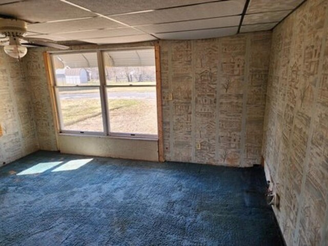 2488 Montana Ave, Saginaw, MI 48601 - empty room with carpet flooring, ceiling fan, and a paneled ceiling