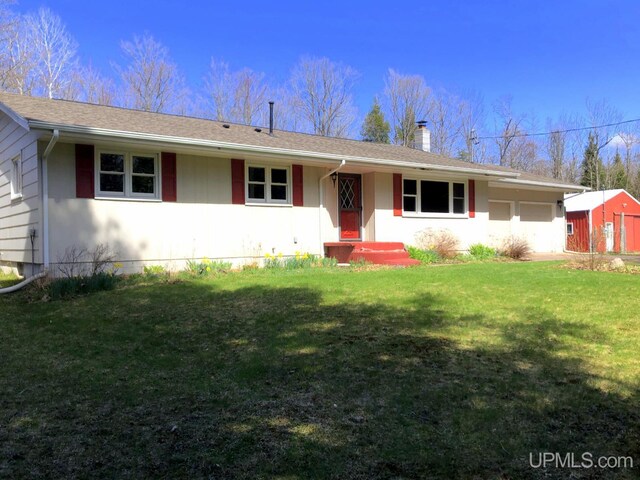 702 Dalton Rd, Skandia, MI 49855 - ranch-style home with a chimney and a front lawn
