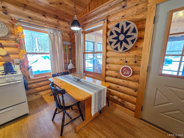 dining area featuring wood ceiling, wood finished floors, and lofted ceiling