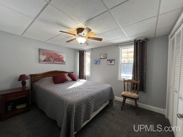 E3117 H44 Hwy, Trenary, MI 49891 - carpeted bedroom with a drop ceiling, a ceiling fan, baseboards, and a closet