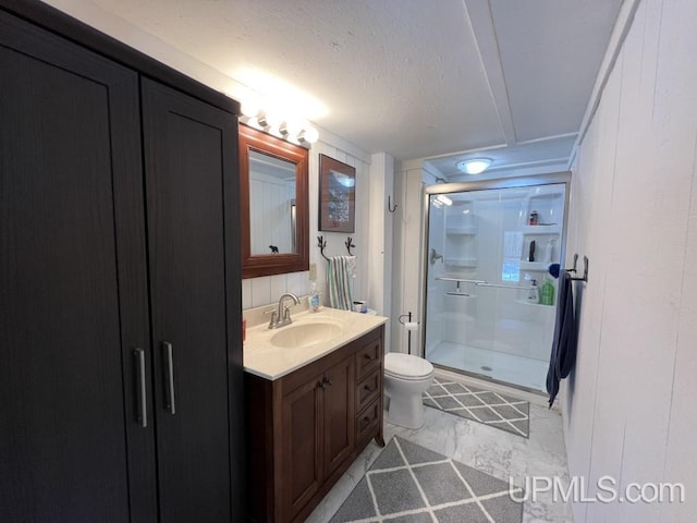 E3117 H44 Hwy, Trenary, MI 49891 - full bath with a shower stall, vanity, toilet, and a textured ceiling