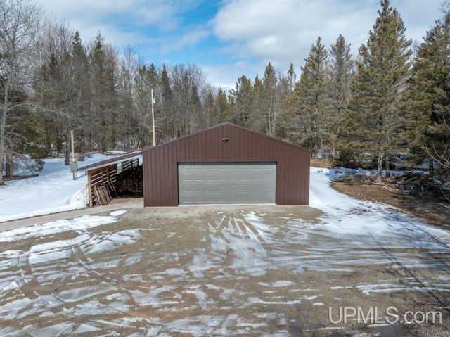 E3117 H44 Hwy, Trenary, MI 49891 - snow covered garage with a detached garage