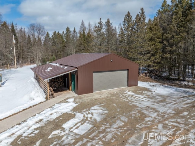 E3117 H44 Hwy, Trenary, MI 49891 - snow covered garage featuring a detached garage