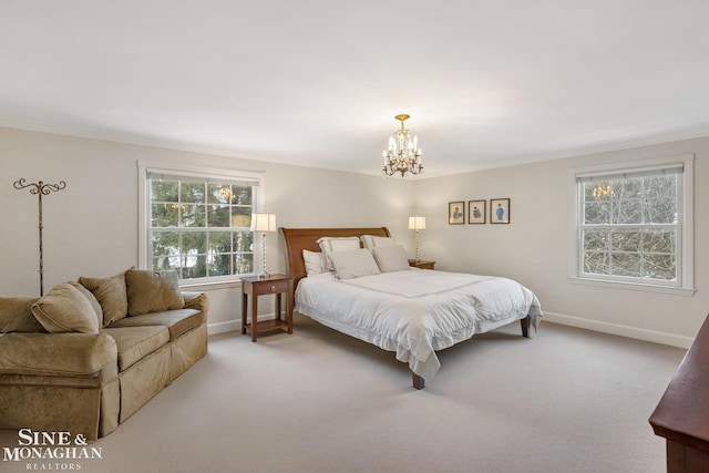 bedroom with an inviting chandelier, crown molding, baseboards, and light colored carpet