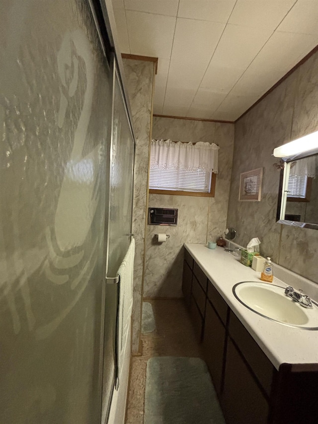 full bathroom with a shower stall and vanity