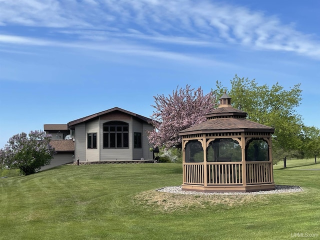 661 S Range Rd, Ironwood, MI 49938 - rear view of property featuring a gazebo and a lawn