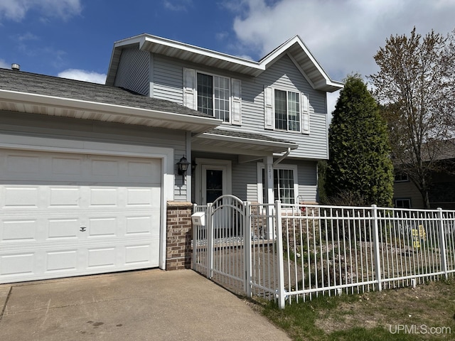 1217 Nakomis, Negaunee, MI 49866 - traditional-style house featuring fence, a garage, driveway, and a shingled roof