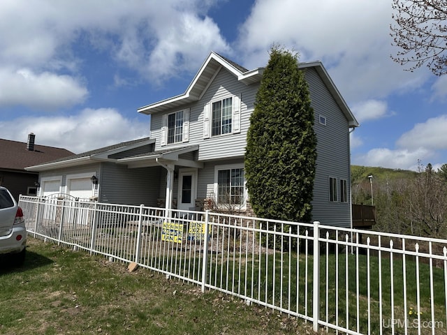 1217 Nakomis, Negaunee, MI 49866 - view of front facade with a garage