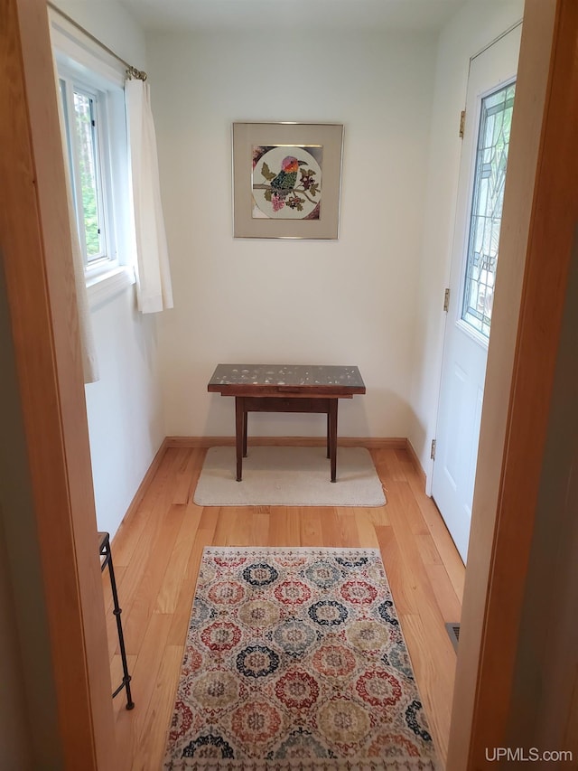 49436 S Superior Rd, Houghton, MI 49931 - hall with baseboards and wood finished floors