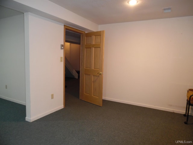49436 S Superior Rd, Houghton, MI 49931 - empty room with baseboards and dark colored carpet