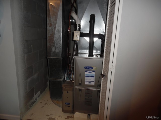 49436 S Superior Rd, Houghton, MI 49931 - utility room with heating unit