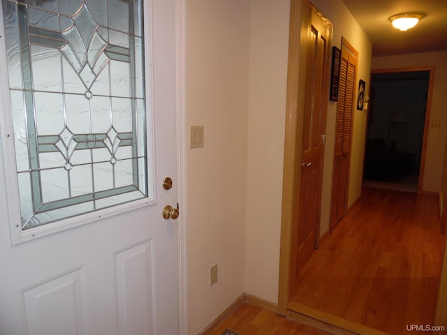 49436 S Superior Rd, Houghton, MI 49931 - doorway featuring light wood-style floors and baseboards