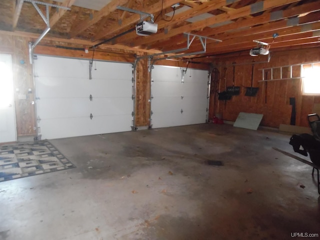 49436 S Superior Rd, Houghton, MI 49931 - garage featuring a garage door opener