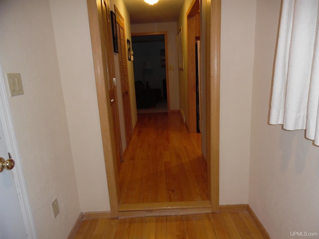 49436 S Superior Rd, Houghton, MI 49931 - corridor featuring baseboards and light wood-type flooring