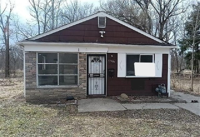 view of front facade featuring stone siding