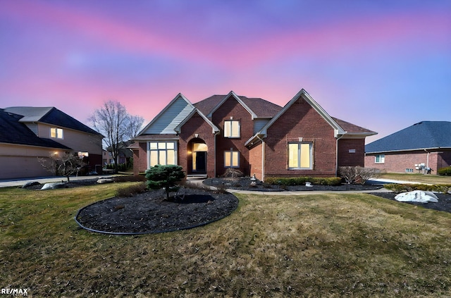 55763 Omni Dr, Shelby, MI 48315 - traditional-style home featuring a front lawn and brick siding