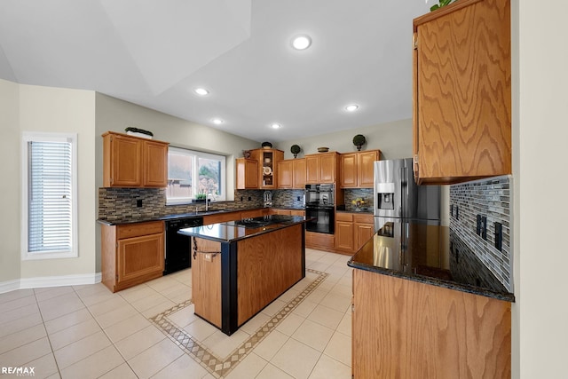 55763 Omni Dr, Shelby, MI 48315 - kitchen with light tile patterned floors, tasteful backsplash, black appliances, a center island, and a sink