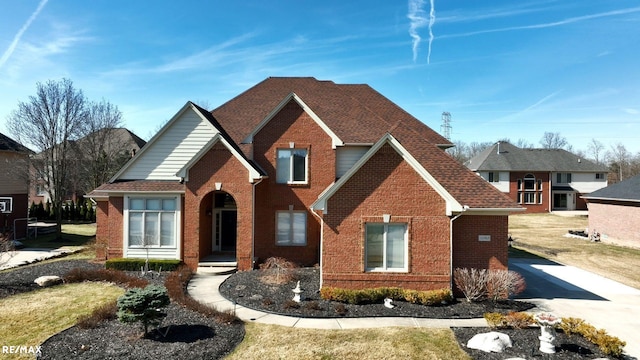55763 Omni Dr, Shelby, MI 48315 - traditional-style home with brick siding and roof with shingles