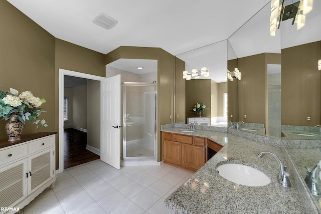 55763 Omni Dr, Shelby, MI 48315 - bathroom with a sink, tile patterned floors, double vanity, and a stall shower
