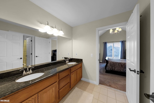 55763 Omni Dr, Shelby, MI 48315 - bathroom featuring tile patterned floors, ensuite bath, a notable chandelier, and a sink