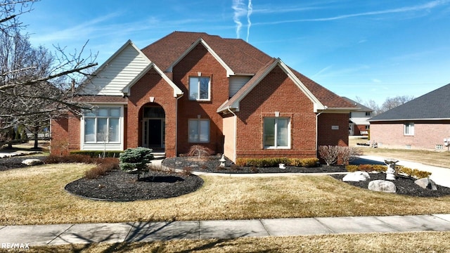 55763 Omni Dr, Shelby, MI 48315 - traditional-style home with a front yard and brick siding