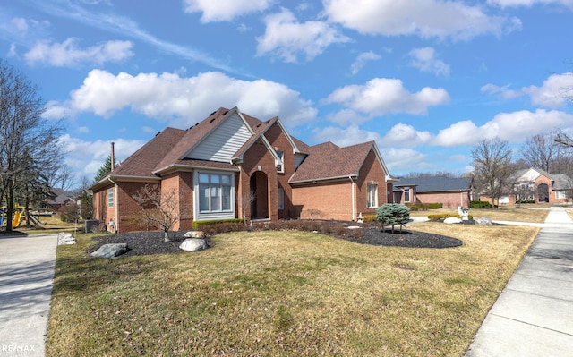 55763 Omni Dr, Shelby, MI 48315 - view of front facade with brick siding and a front yard