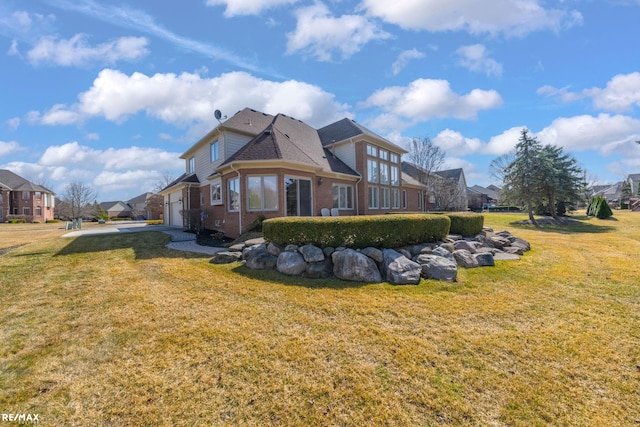 55763 Omni Dr, Shelby, MI 48315 - back of house with a lawn, a residential view, and brick siding