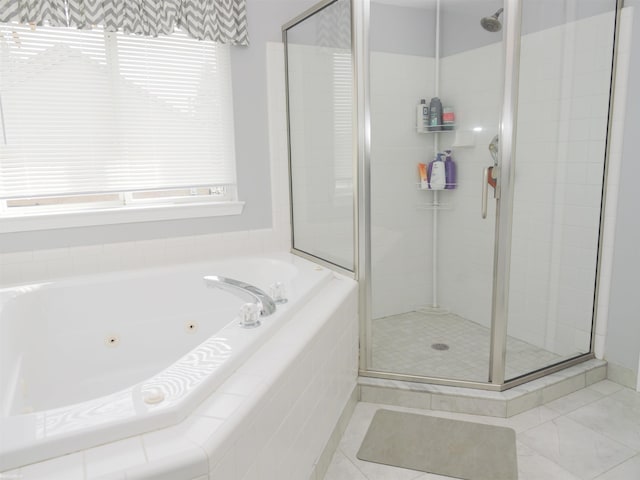 full bathroom featuring a shower stall and a jetted tub