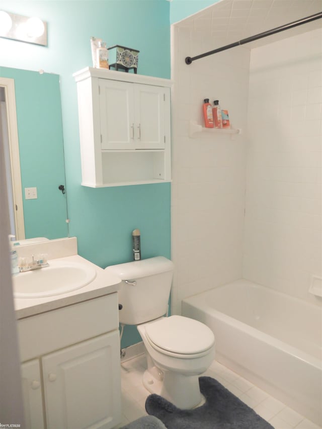 bathroom with tile patterned flooring, vanity, bathtub / shower combination, and toilet