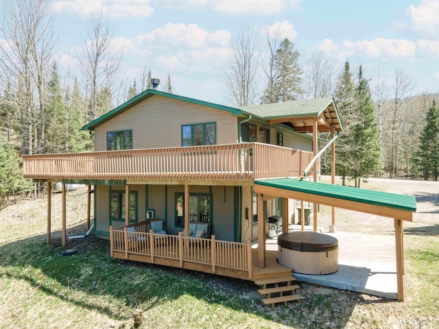 126 Big Bear Rd, Iron River, MI 49935 - back of house featuring a hot tub, a wooden deck, a patio, and outdoor lounge area