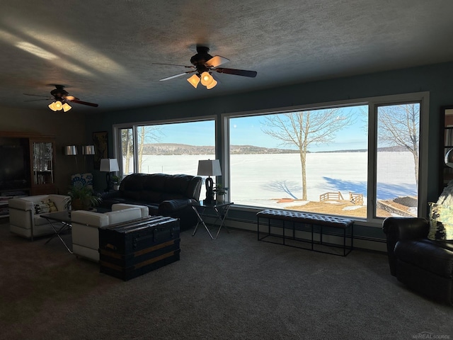 carpeted living area featuring a water view, ceiling fan, and a wealth of natural light