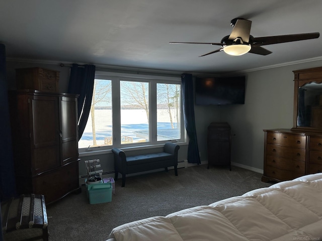 carpeted bedroom featuring ornamental molding, baseboards, and a ceiling fan