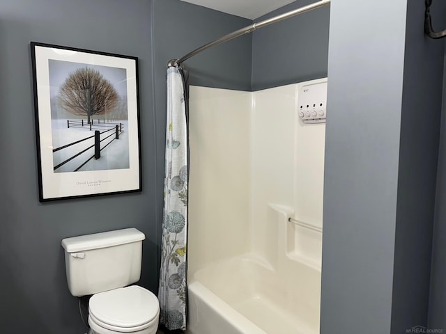 bathroom with toilet and shower / bath combination with curtain