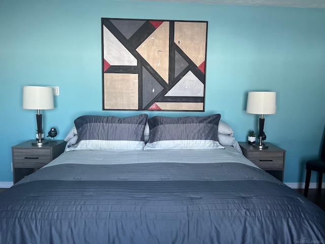 bedroom featuring baseboards